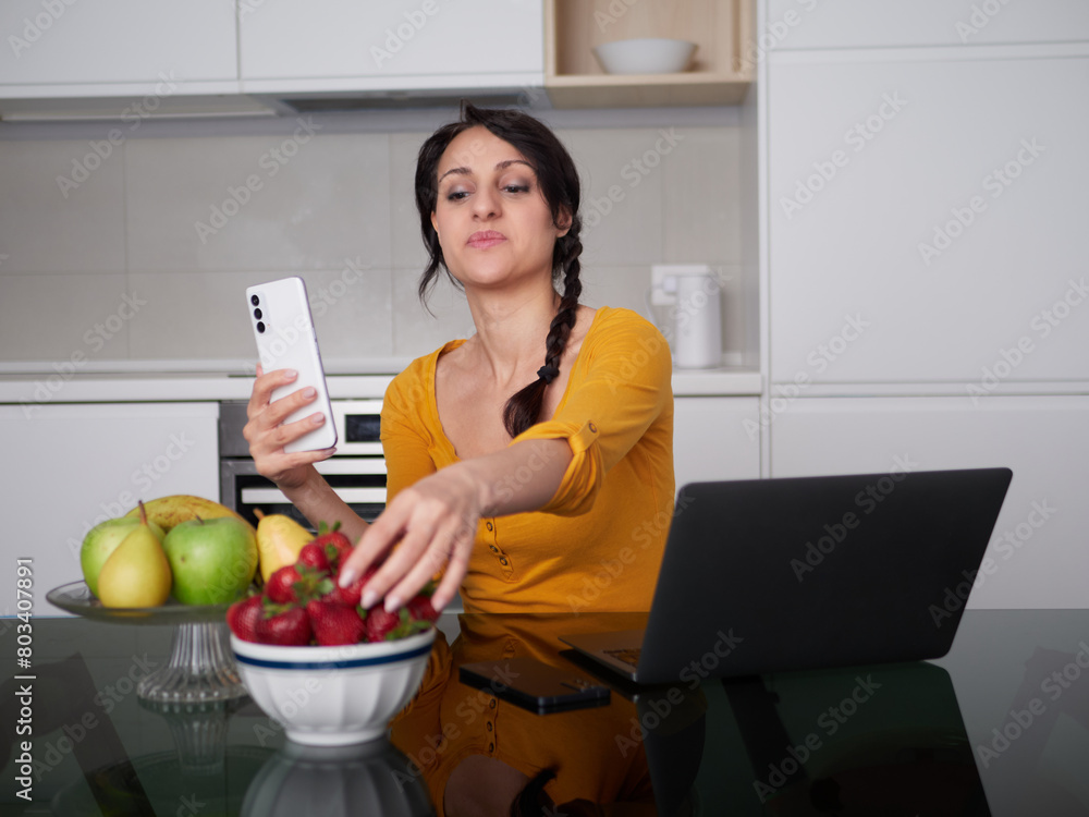 Woman make a pictures of strawberries at home kitchen
Woman make a pictures of strawberries at home kitchen