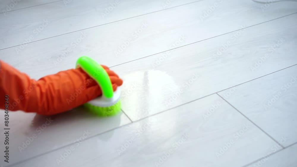 cleans the white floor with a special brush cleans the white floor with a special brush