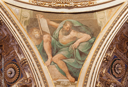 MILAN, ITALY - MARCH 5, 2024: The baroque fresco of St. John the Evangelist from cupola of church Chiesa di San Vittore al Corpo Guglielmo Caccia - Moncalvo (1568 – 1625) photo
