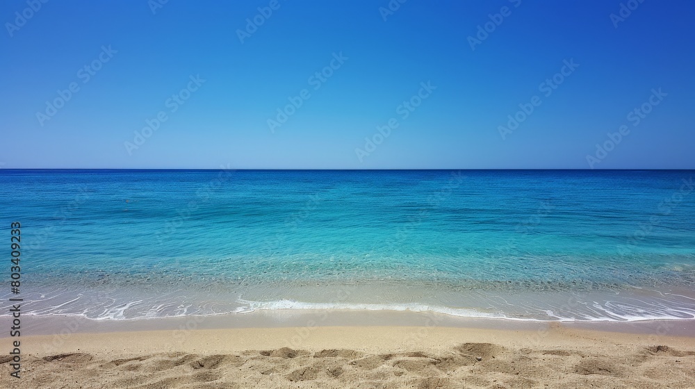 Sandy Beach With Blue Water and Blue Sky