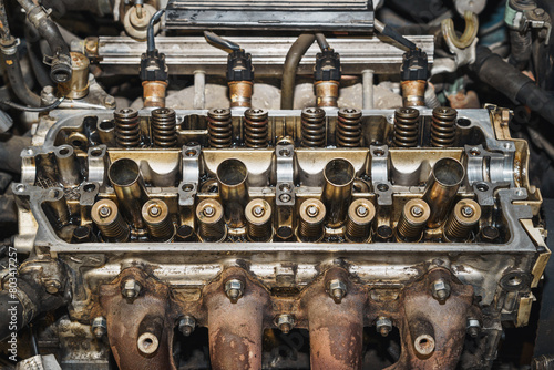 Top view of a car engine. Cylinder heads. Valves. Valve springs. Sixteen valves. Engine block. Auto service. Car repairing. 