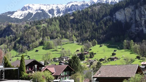 Wallpaper Mural Train driving uphill to Wengen in Lauterbrunnen valley, Swiss mountain landscape Torontodigital.ca