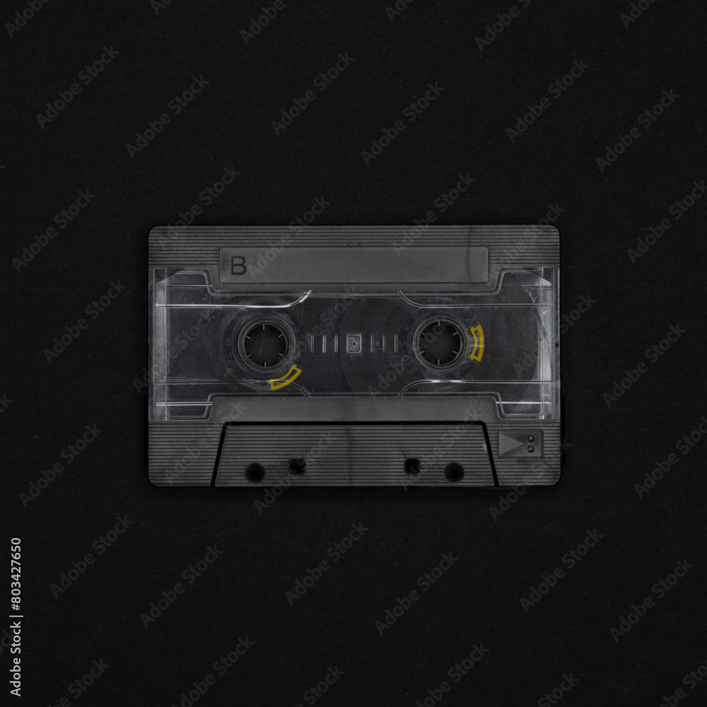 Obraz premium Vintage blank cassette tape on a black background
