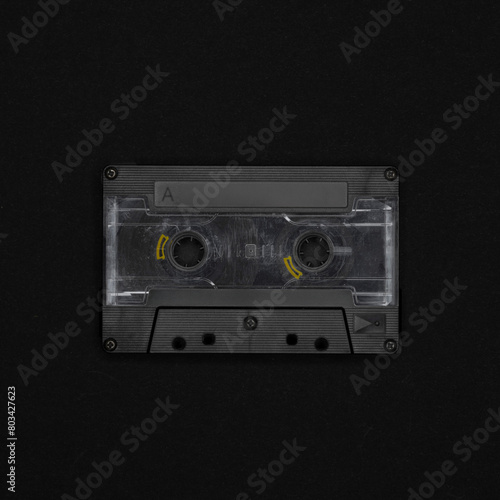 Vintage blank cassette tape on a black background