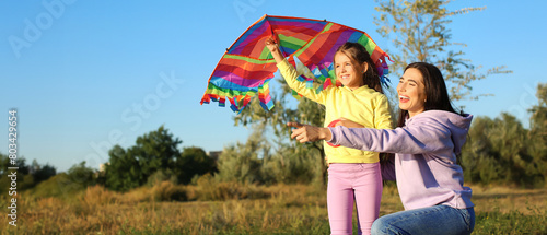 Cute little girl with kite ...