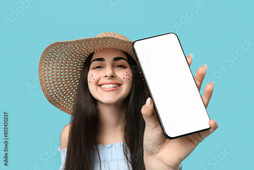 Young happy woman with mobi...