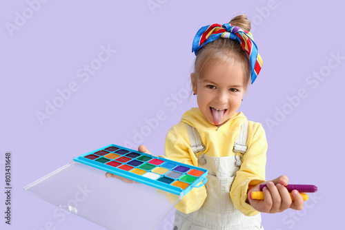 Cute little girl with paint...