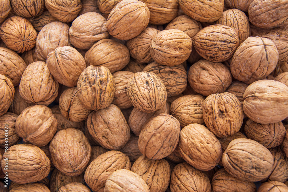 Screen walnut textured background covered with walnuts Screen walnut textured background covered with walnuts