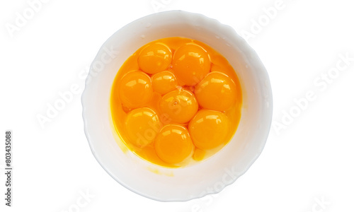 Egg yolks in a white plate on a white background.