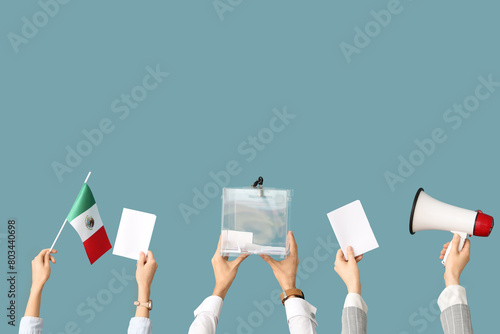 Hands holding ballot box, flag of Mexico, megaphone and voting papers on blue background. Election concept