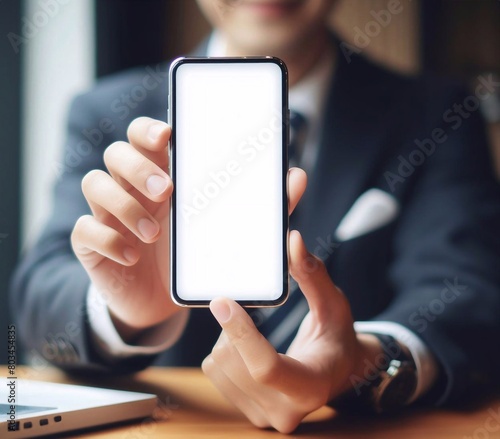 Smartphone with blank white screen held by an Asian person generative ai art © gmm2000