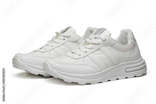 Women's white sneakers on a white background © Олег Мальшаков