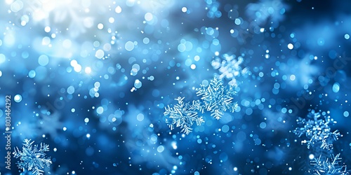 a blue background with snowflakes and blurry lights