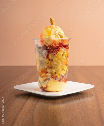 Mango Ice cream with fresh Fruits and Dry Fruits, vermicelli, poppy seeds and Milk  photo