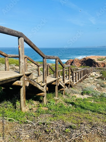 wooden walkway leading to a viewpoint near Praia da Bordeira in the Algarve