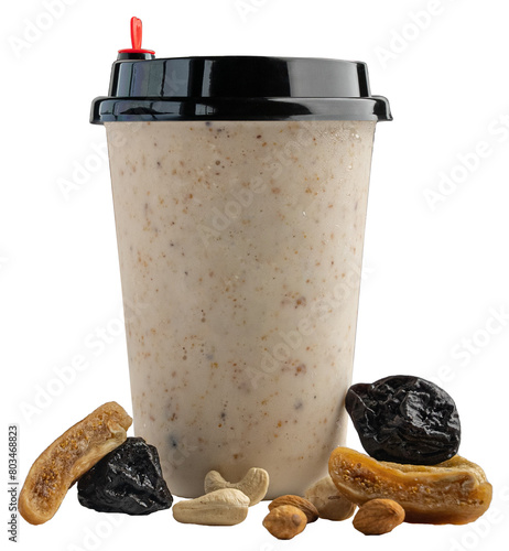 A glass mixed dry fruits and nuts milk shake