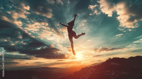 A figure leaping in the air, expressing freedom and liberation photo