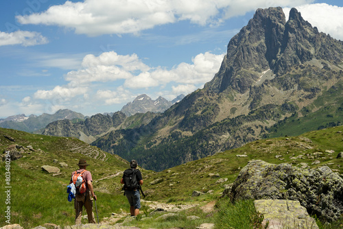 Middle aged couple hiking in beautiful mountains in Pyrenees (Lacs d' Ayous), popular hiking route, France photo