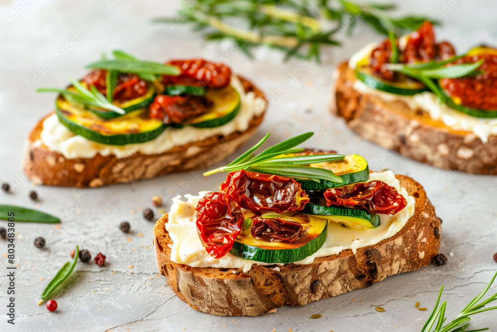 Bruschetta, bread toast, canape with cream cheese, zucchini and dried tomato with herbs Bruschetta, bread toast, canape with cream cheese, zucchini and dried tomato with herbs