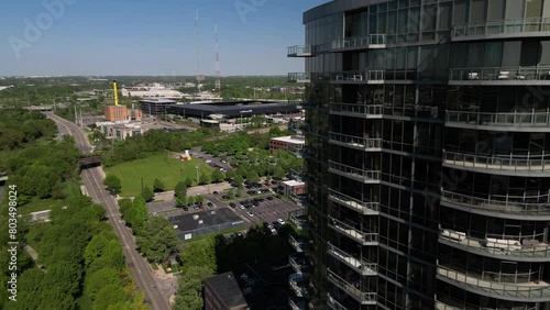 2024 cinematic aerial of modern building in columbus ohio in the downtown morning light with a style stadium in the background