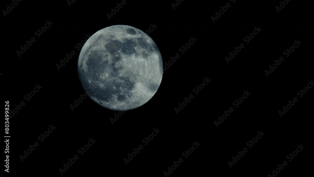 A large full moon moves slowly across the night sky. With each passing moment, the moon grows larger and more commanding, dominating the canvas with its otherworldly presence. A large full moon moves slowly across the night sky. With each passing moment, the moon grows larger and more commanding, dominating the canvas with its otherworldly presence.