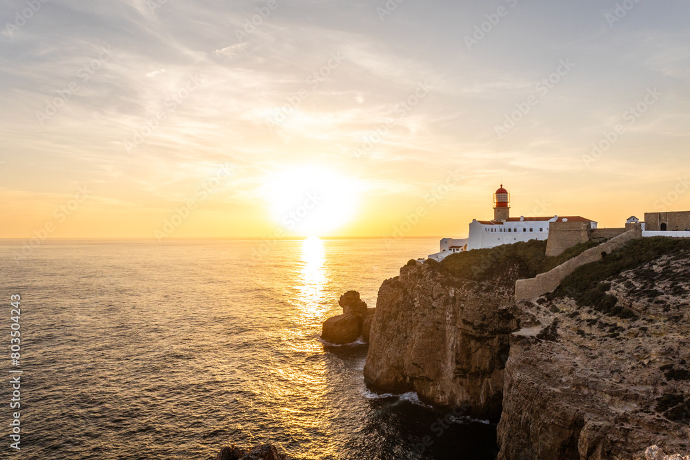 Farol do Cabo de Sao Vincente in Sagres in the Algarve Portugal. Overlooking the blue sea during a beautiful golden sunset