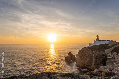 Farol do Cabo de Sao Vincente in Sagres in the Algarve Portugal. Overlooking the blue sea during a beautiful golden sunset