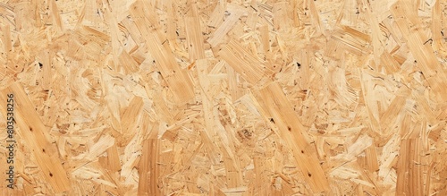 Close-up texture of oriented strand board - OSB wood displayed on a pressed wooden panel background.