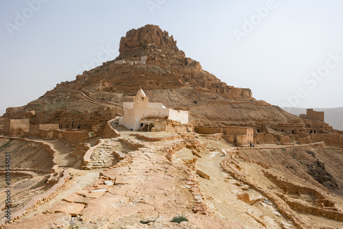 Panoramic view of ruins Berber mountain village Guermassa, Tataouine in southern Tunisia photo