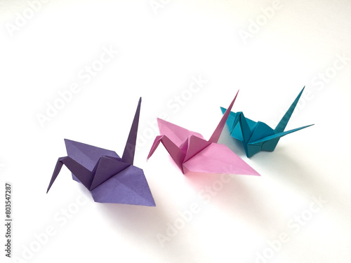 Three origami paper birds