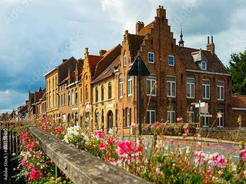 Picturesque view of Diksmuide street with typical residential buildings on sunny summer day, Belgium.
