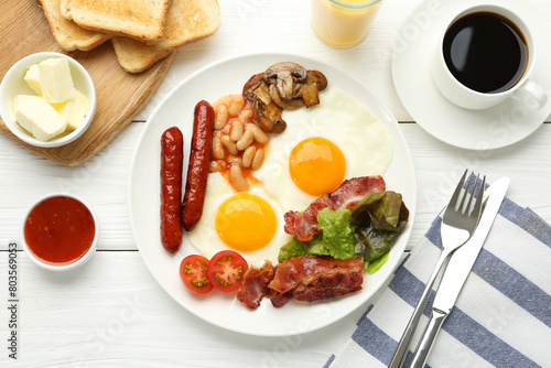 Delicious breakfast with sunny side up eggs served on white wooden table, flat lay