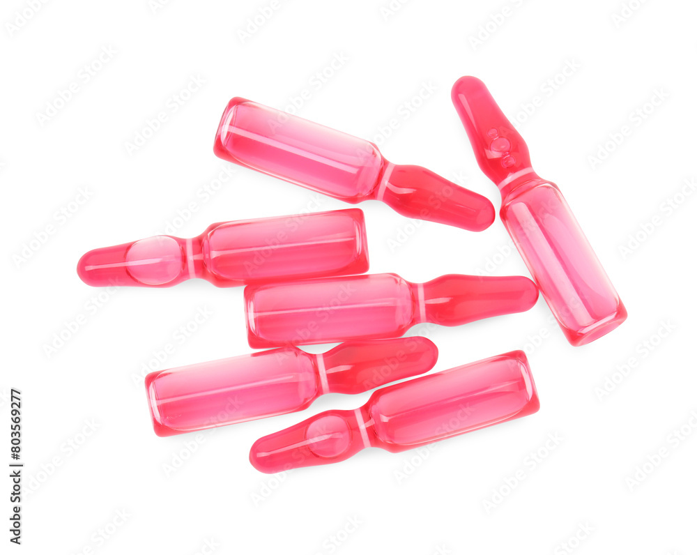Glass ampoules with liquid isolated on white, top view Glass ampoules with liquid isolated on white, top view
