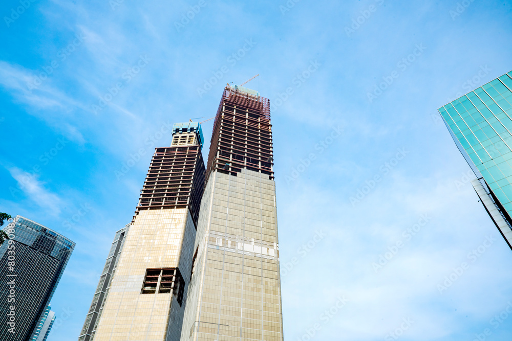 Skyscrapers and office building with blue sky