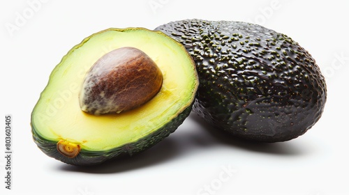 A perfectly ripe avocado halved with the pit visible, set against a pure white background for a minimalistic look