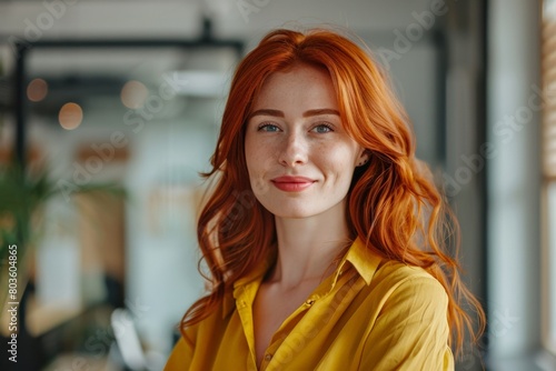 Portrait of a young business woman with red hair