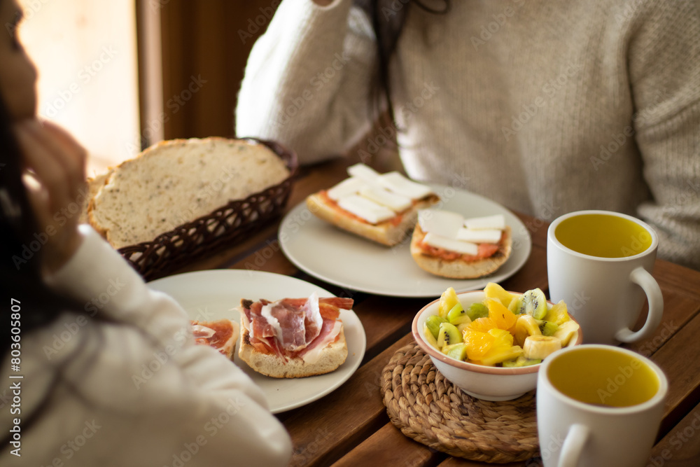 Spanish breakfast with serrano ham and fruit at home. Spanish breakfast with serrano ham and fruit at home.