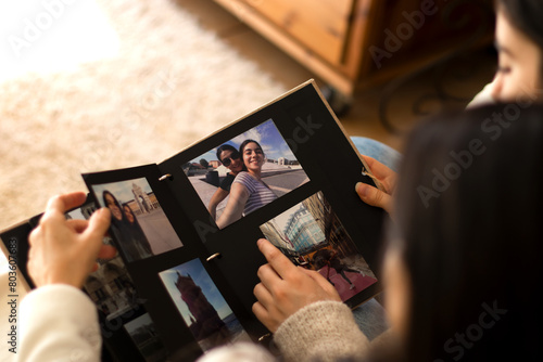People watching a photo album of themselves