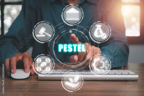 Pestel concept, Businessman hand touching pestel icon on virtual screen.