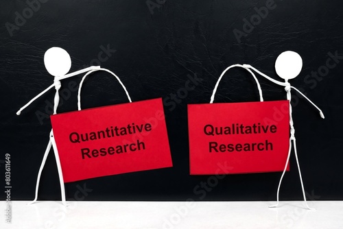 Obraz na płótnie Quantitative vs qualitative research concept. Human stick figure holding red placard paper with written text. w salonie
