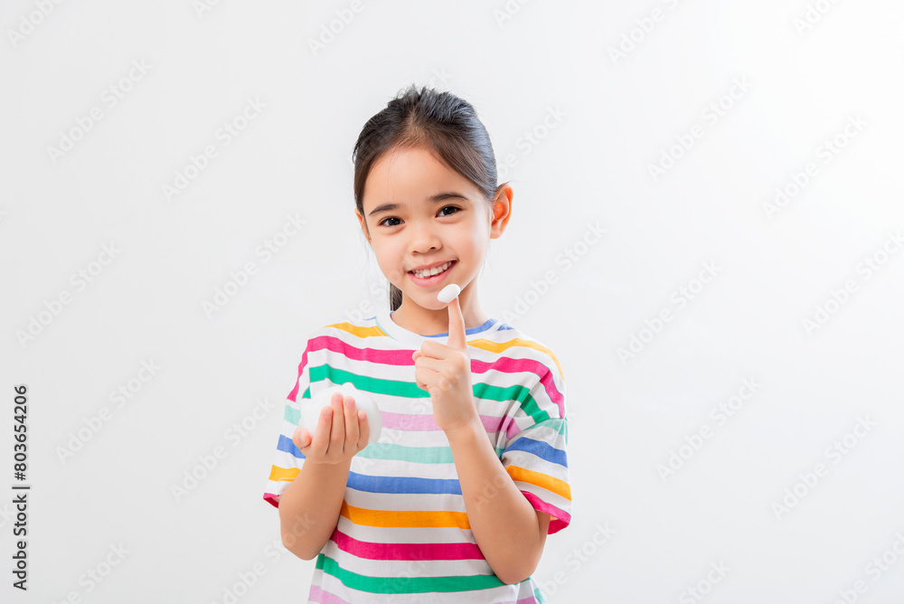 Cute Asian girl, holding foam, washing her face Cute Asian girl, holding foam, washing her face