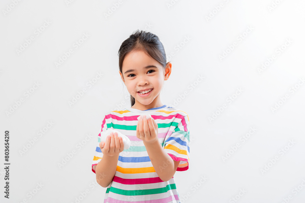 Cute Asian girl, holding foam, washing her face Cute Asian girl, holding foam, washing her face
