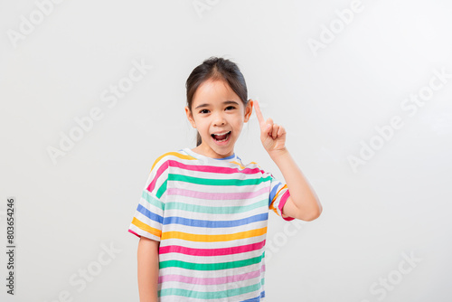 Cheerful Asian girl Posing cutely on a white background