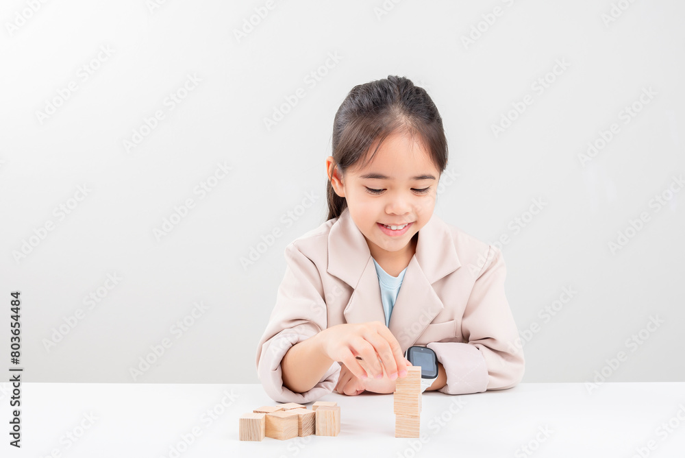 little business girlplacing wooden blocks little business girlplacing wooden blocks