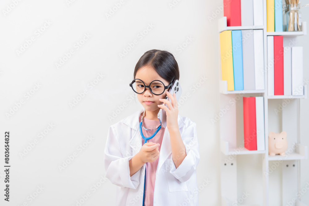 Cute little girl asian with stethoscope playing doctor Cute little girl asian with stethoscope playing doctor