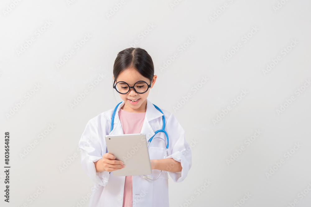 Cute little girl asian with stethoscope playing doctor Cute little girl asian with stethoscope playing doctor