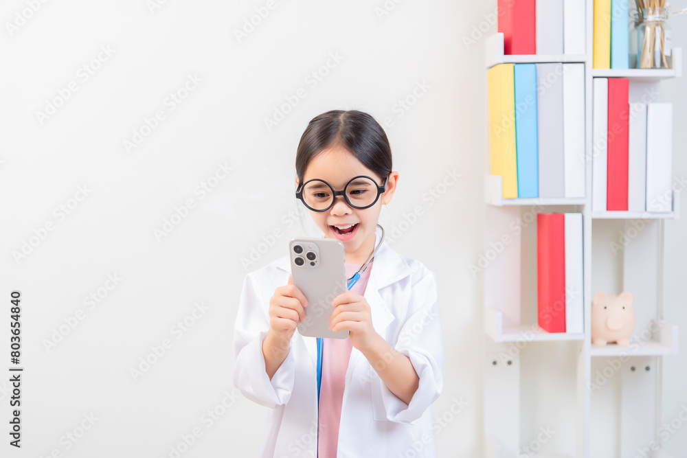 Cute little girl asian with stethoscope playing doctor Cute little girl asian with stethoscope playing doctor