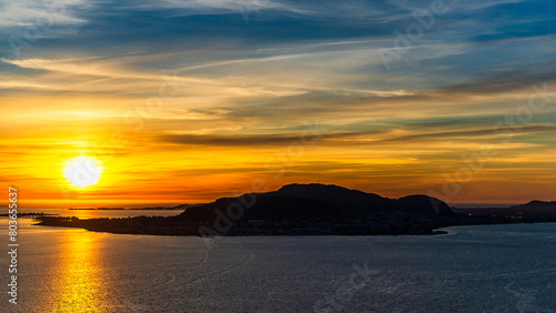  top view of a sunset over The city of Alesund and the sea during a sunny evening, Norway © fruttuoso
