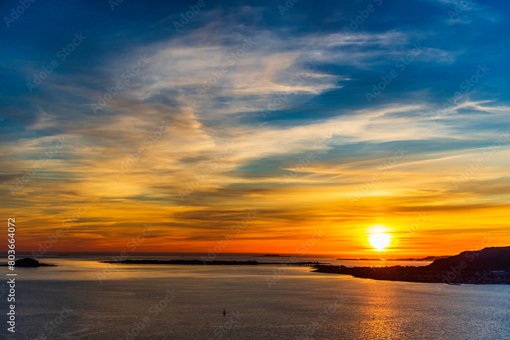 Obraz premium top view of a sunset over The city of Alesund and the sea during a sunny evening, Norway