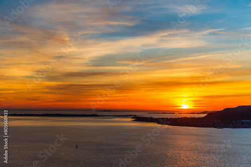  top view of a sunset over The city of Alesund and the sea during a sunny evening  Norway